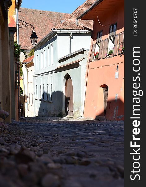 Paved street with old houses in Sighisoara
