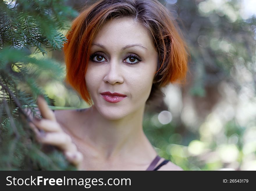 Portrait of pretty redhead girl on a walk