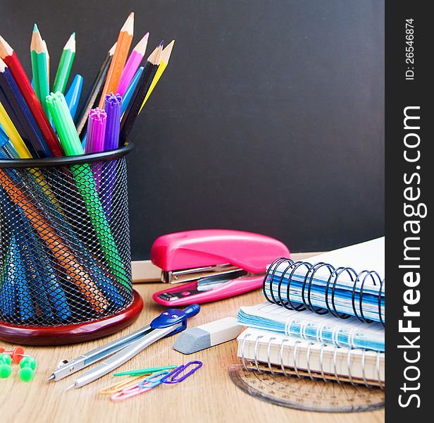 Small elementary blackboard with various school supplies. Small elementary blackboard with various school supplies