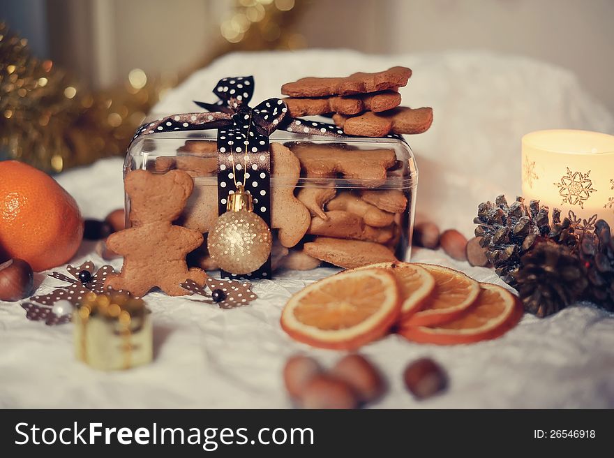 On a white table with a box of cookies and orange segments. On a white table with a box of cookies and orange segments