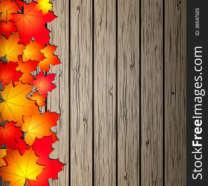 Autumn Leaves over wooden background.