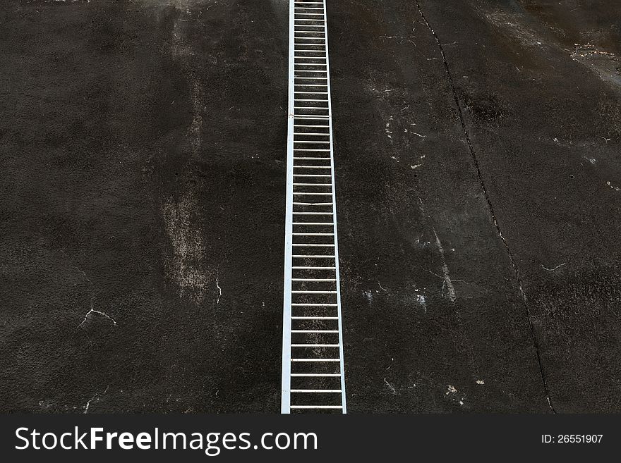 Ladder on a wall to nowhere. Ladder on a wall to nowhere