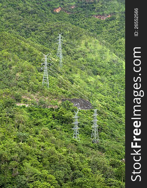 High Voltage Electric Post against the forest. High Voltage Electric Post against the forest