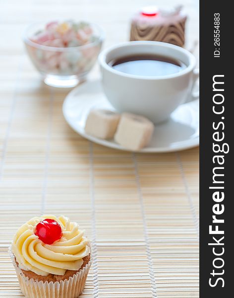 Tea, fresh cherry muffin, colorful delight and various cake, sweet dessert, with place for your text, soft focus. Tea, fresh cherry muffin, colorful delight and various cake, sweet dessert, with place for your text, soft focus