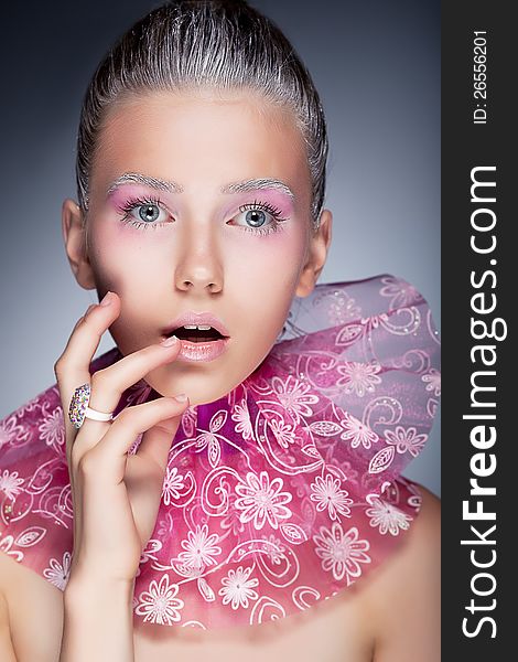 Fashion beauty portrait. girl touching her face - holiday pink make up. Fashion beauty portrait. girl touching her face - holiday pink make up