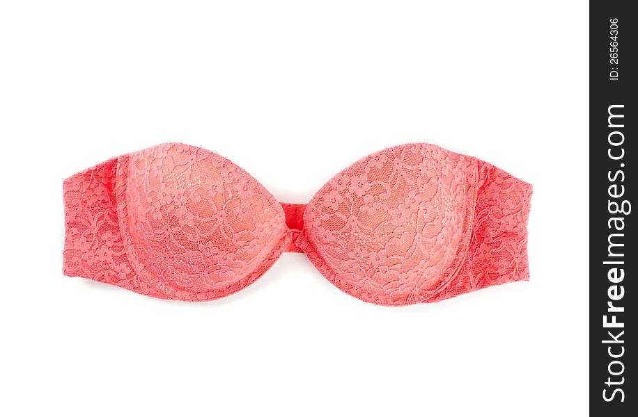 A pink lace strapless bra isolated on white.