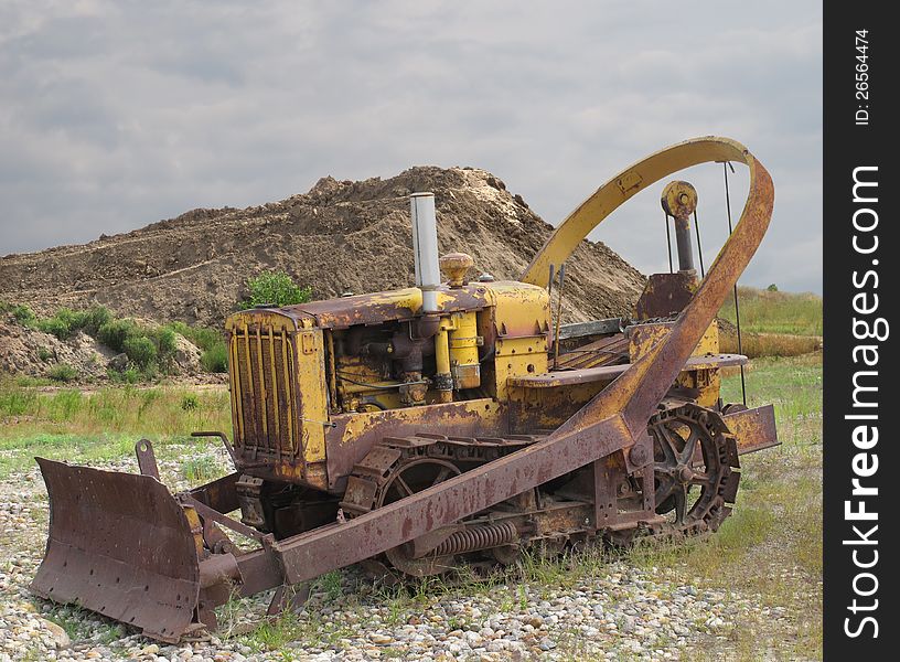 Old rusted bulldozer tractor with blade