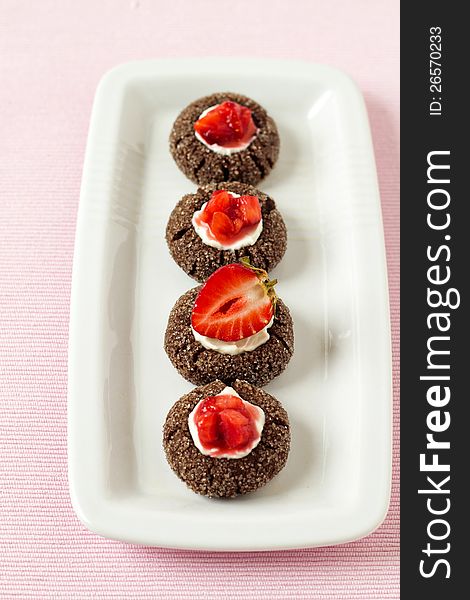 Chocolate thumbprint cookies with cream cheese and strawberries