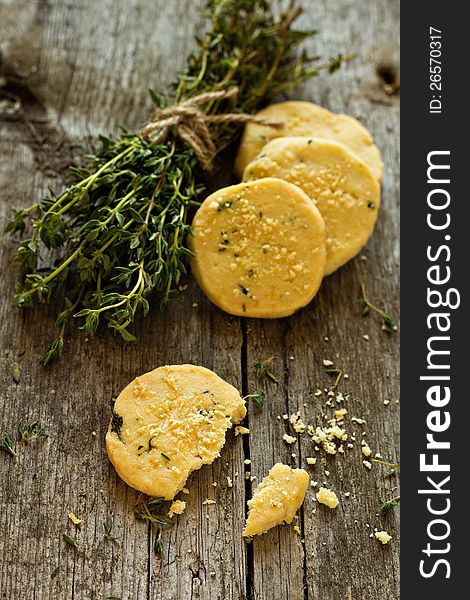 Shortbread cookies with thyme and parmesan on a wooden table