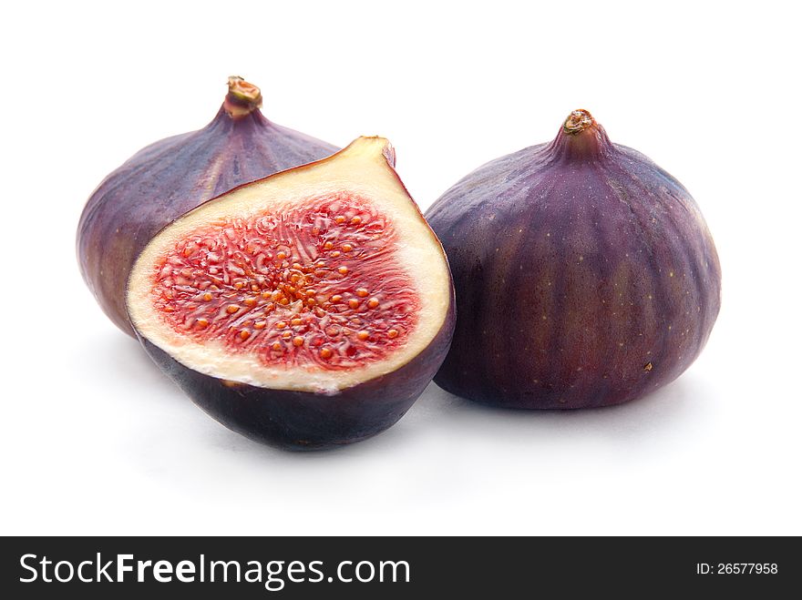 Two Figs and Slice Isolated on White Background. Two Figs and Slice Isolated on White Background