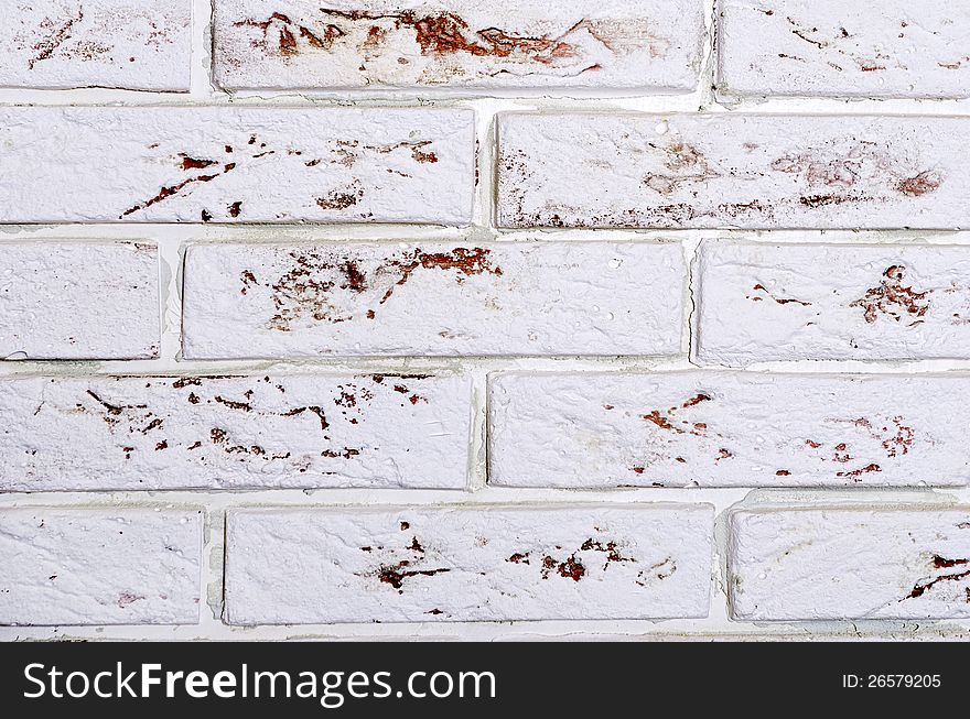 Decorative masonry wall of white brick. Decorative masonry wall of white brick