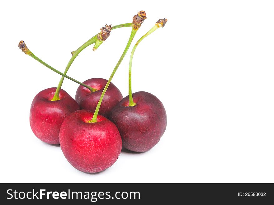 Four fresh red cherry on white background