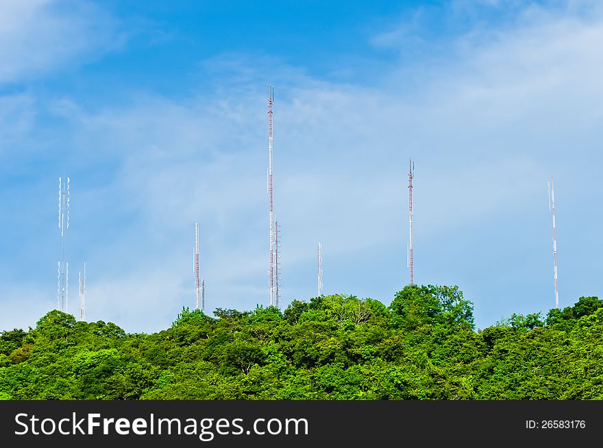 Group of steel communication antenna from tree to cloud blue sky. Group of steel communication antenna from tree to cloud blue sky