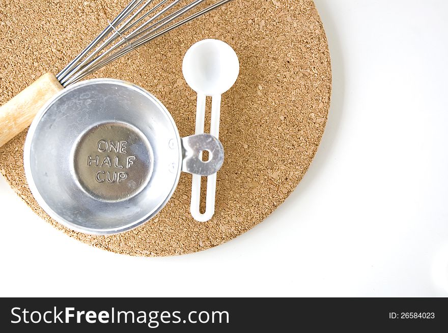 Measuring one half cup with spoon on board