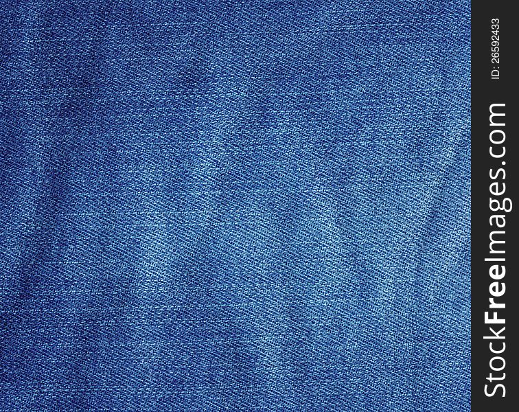 Crumpled blue jeans fabric texture. Crumpled blue jeans fabric texture