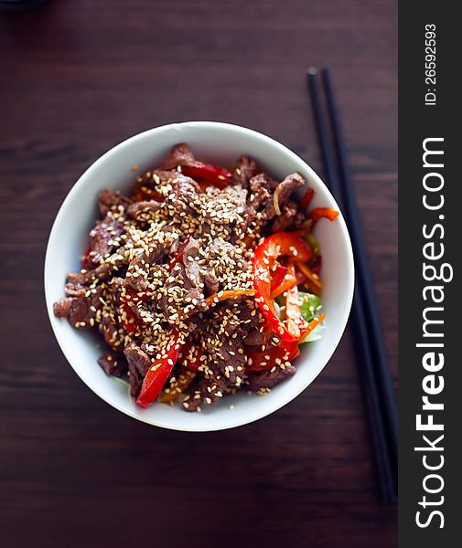 Asian salad with vegetables, beef and sesame