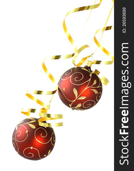 Two red Christmas tree balls with curly ribbons on white background. Two red Christmas tree balls with curly ribbons on white background