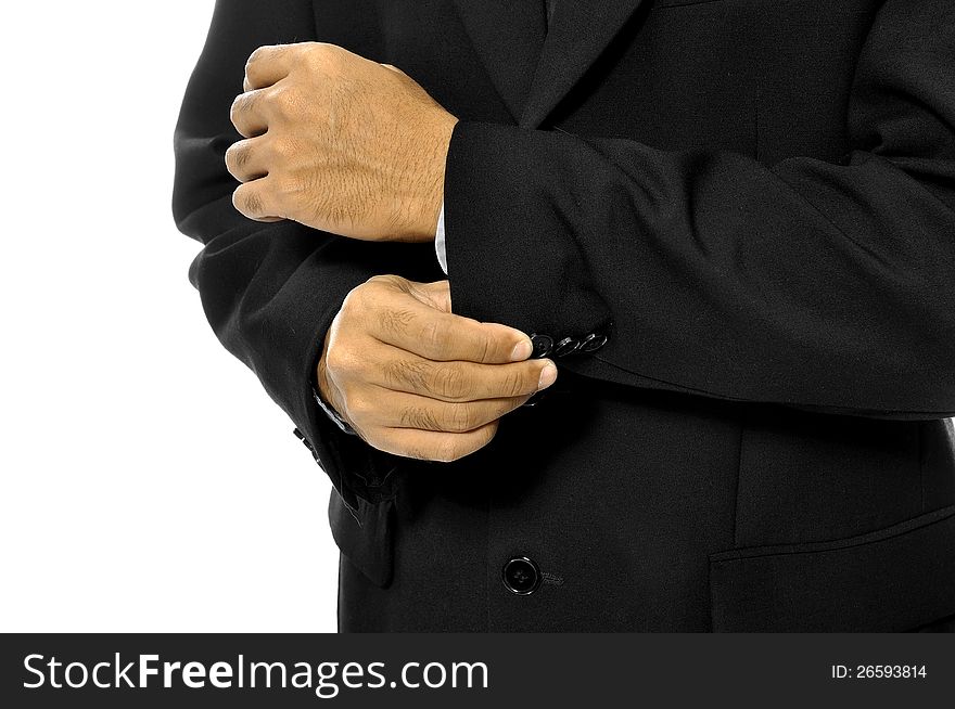 Man buttoning his sleeve isolated over white background