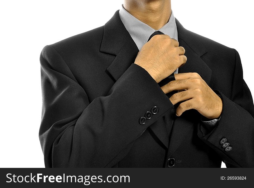 Business man adjusting tie isolated over white background. Business man adjusting tie isolated over white background