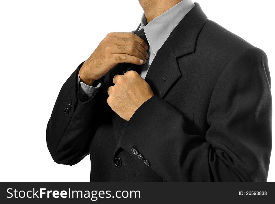 Business man adjusting tie isolated over white background. Business man adjusting tie isolated over white background