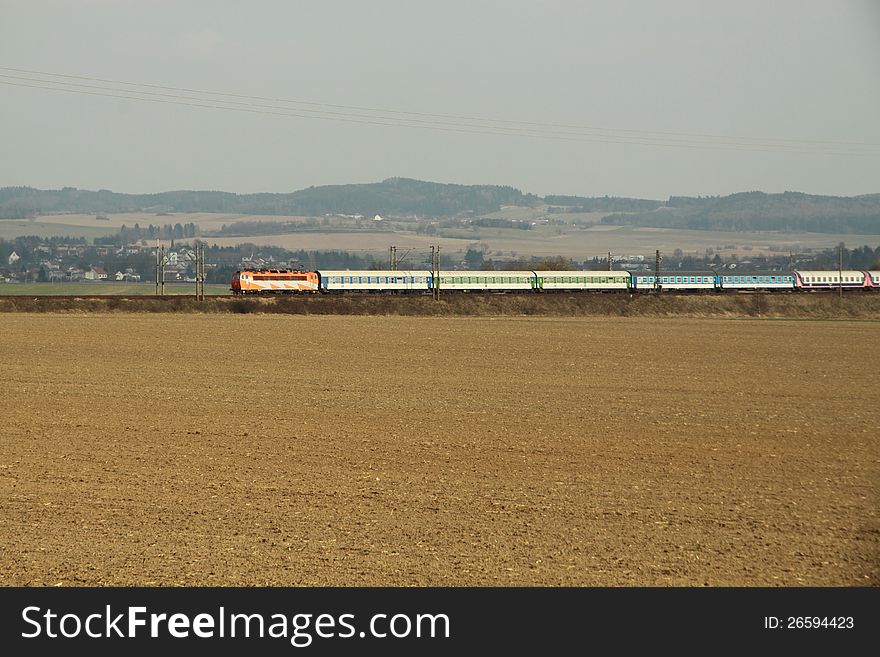 Train with wagons and field