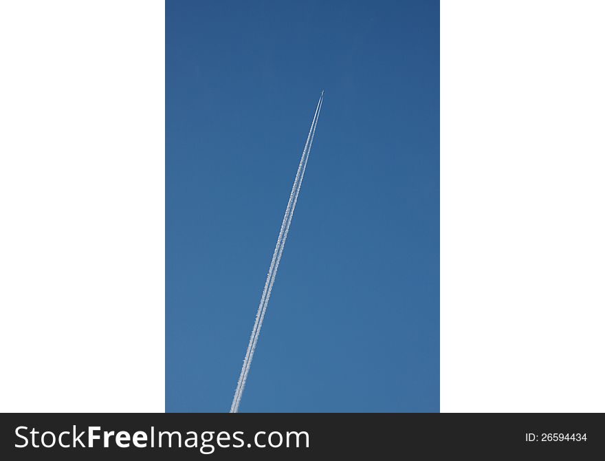Aeroplane in the air with white lines