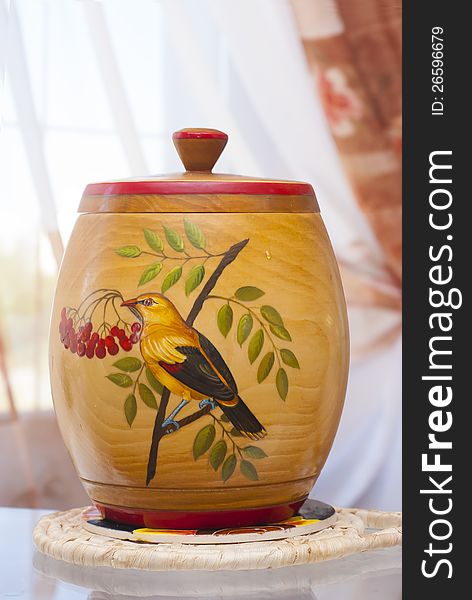 Household wooden pot with drawing of bird. Household wooden pot with drawing of bird