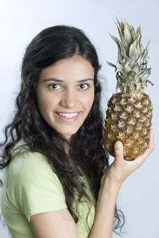 Girl Holding Pineapple Stock Photo