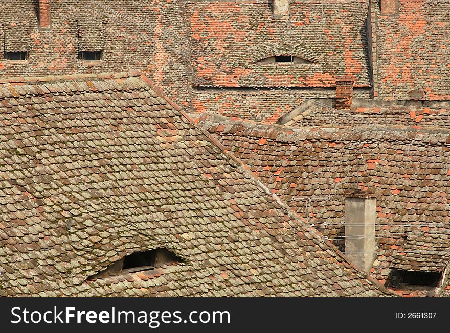 Abstract image generated by specific roofs .The place is located in Sibiu(Hermanstadt),Romania,a city which is during 2007 the European Cultural Capital.This group of images is a great source  of specific Romanian( European) landmarks from a hot place in 2007. Abstract image generated by specific roofs .The place is located in Sibiu(Hermanstadt),Romania,a city which is during 2007 the European Cultural Capital.This group of images is a great source  of specific Romanian( European) landmarks from a hot place in 2007.
