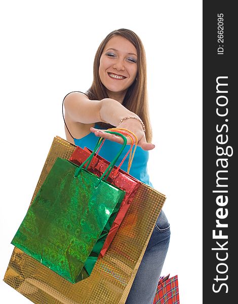 Beauty girl shopping with colored bags over white background