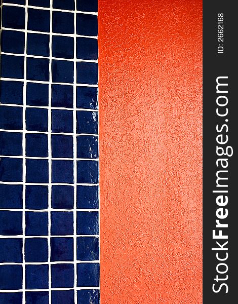 A wall with blue tile and red stucco, useful for backgrounds. A wall with blue tile and red stucco, useful for backgrounds