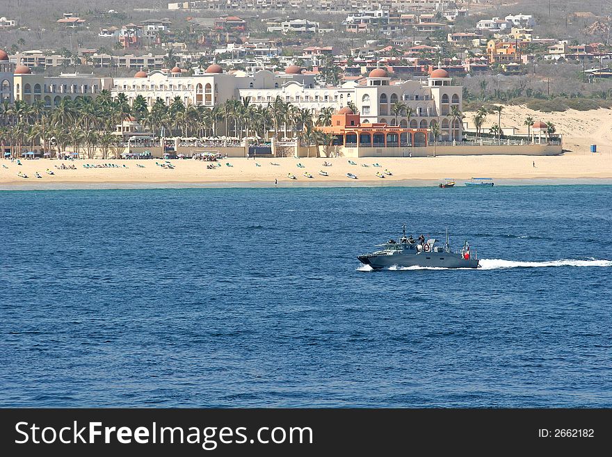 A port patrol boat speeding across the bay