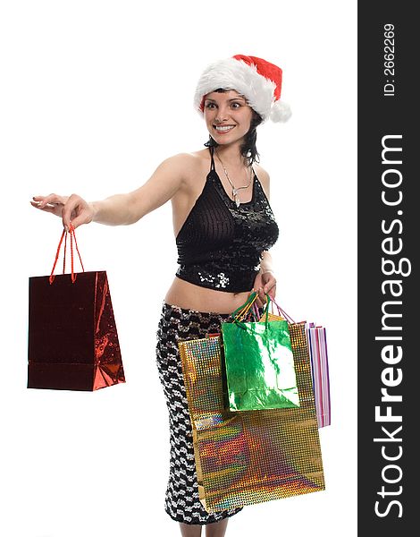 Beauty girl in red cap with gifts over white background