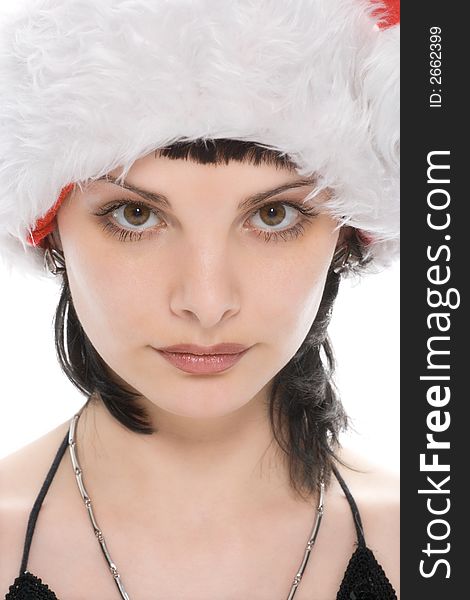 Close-up portrait beauty christmas girl in red cap over white background