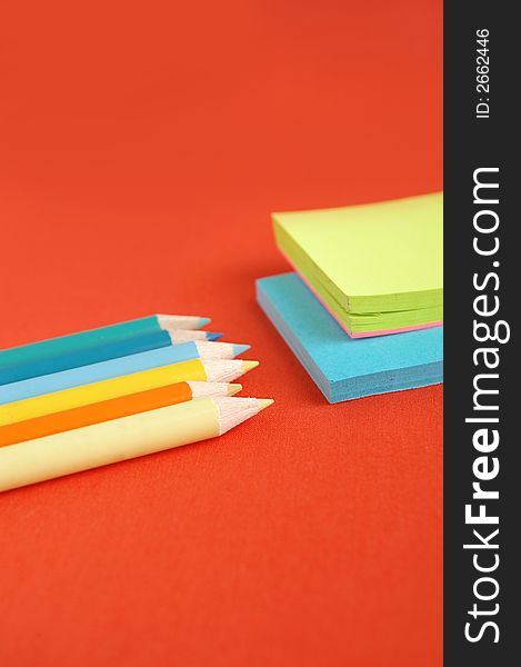 Notepads and pencils in vivid colors. Notepads and pencils in vivid colors