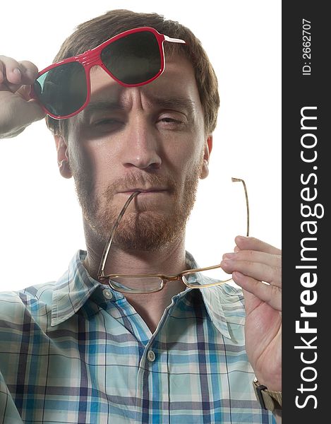 Close up portrait of Caucasian man changing from reading to sun glasses. Close up portrait of Caucasian man changing from reading to sun glasses.