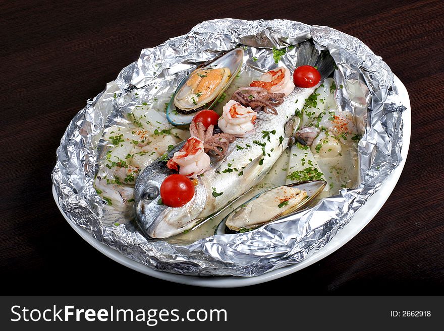 Italian dish: dorado fish with seafoods