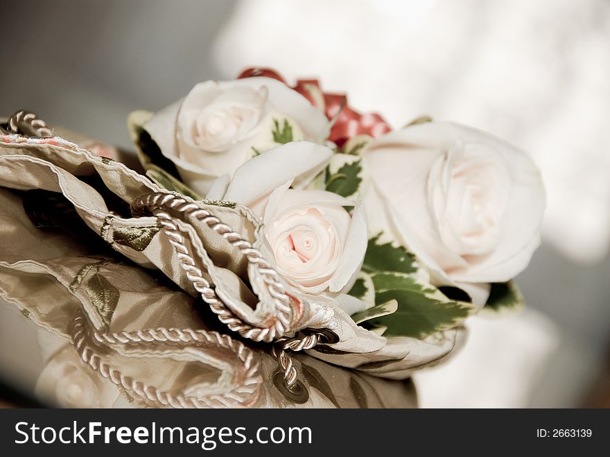 The brides corsage with a purse on the table. The brides corsage with a purse on the table