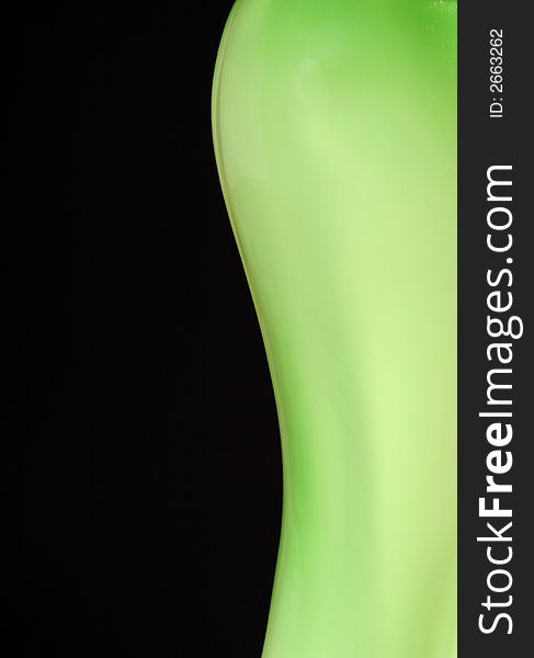 Green vase body on the black