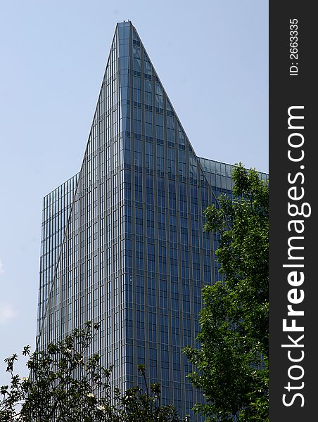 Blue glass office tower against the sky. Blue glass office tower against the sky