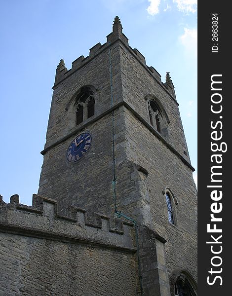 British village Church, dating from 1200 AD. Tower and clock. British village Church, dating from 1200 AD. Tower and clock.