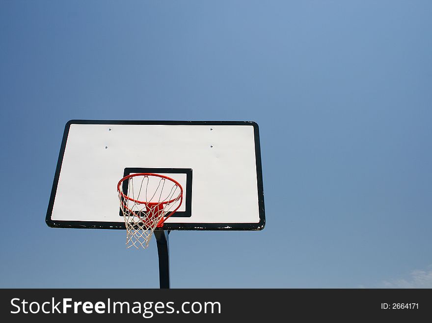 Basketball hoop, street basketball under clear blue sky. Basketball hoop, street basketball under clear blue sky