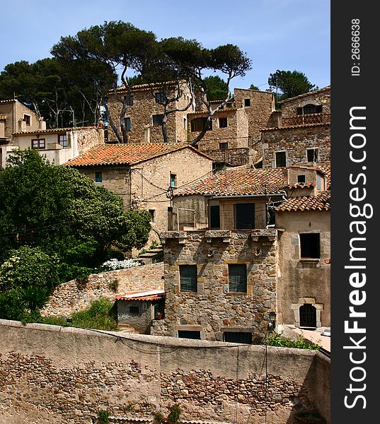 Crowded houses jostle together in the old town of Tossa de Mar, Catalonia, Spain