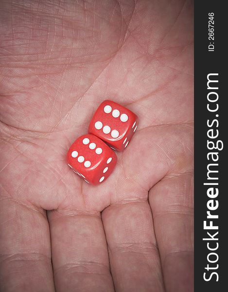 A Man's hand holding luckky dice. A Man's hand holding luckky dice