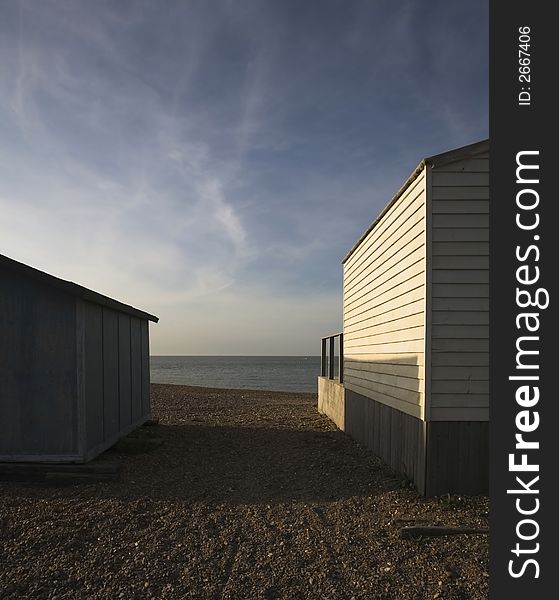 English summer seaside huts in evening sun. English summer seaside huts in evening sun