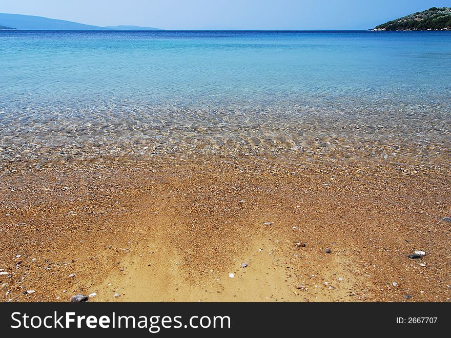 Wide angle shot of the crystal clear waters of a mediterranean beach. Wide angle shot of the crystal clear waters of a mediterranean beach