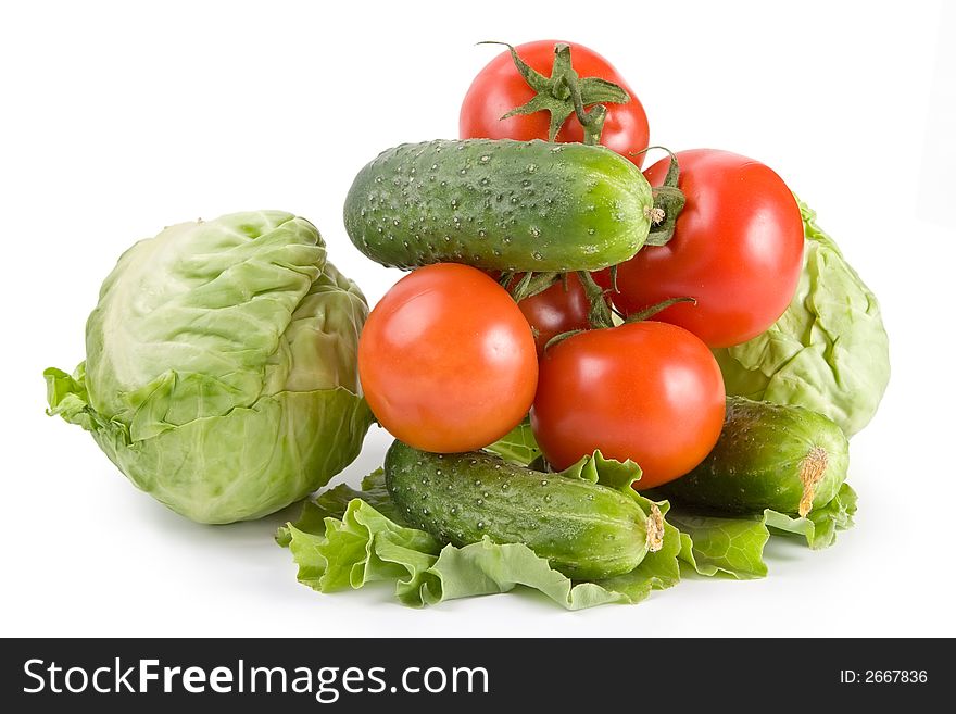 Cabbage, lettuce, cucumbers, tomatoes-rich vegetarian meal. Cabbage, lettuce, cucumbers, tomatoes-rich vegetarian meal