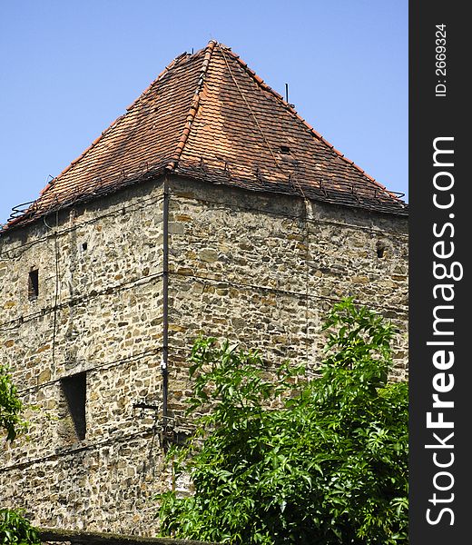 Old european city stone tower in summer