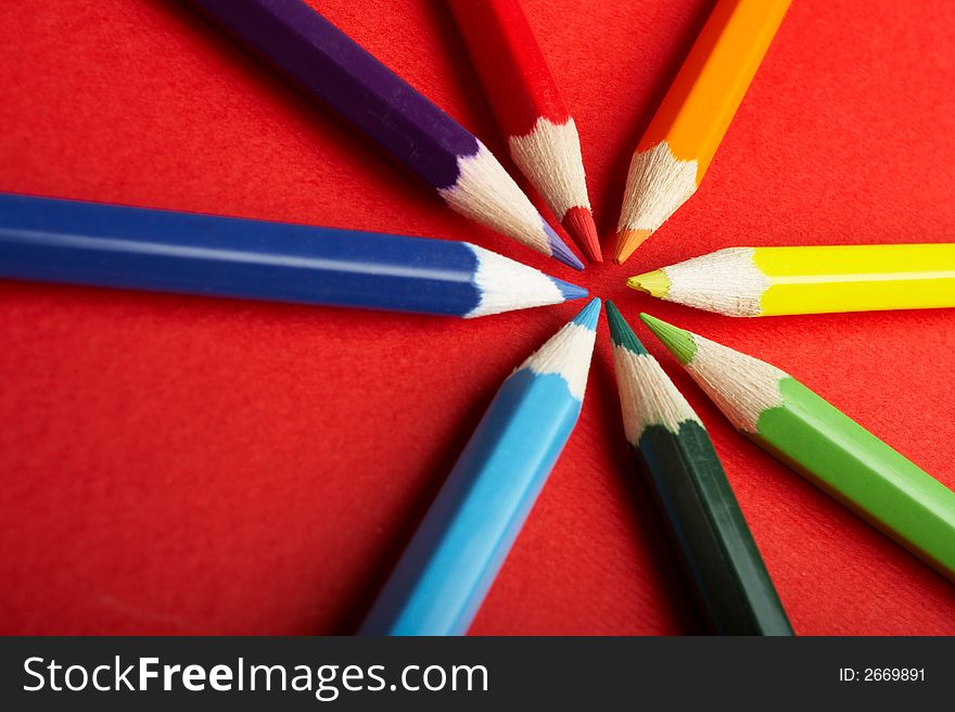 A Circle of Colored Pencils on Red Background - check my gallery for more pictures. A Circle of Colored Pencils on Red Background - check my gallery for more pictures