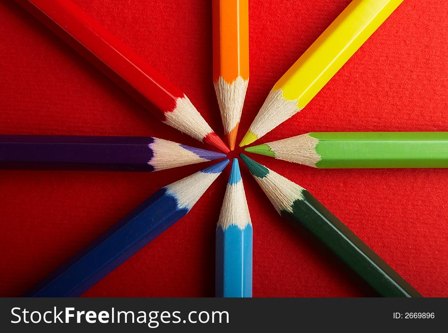 A Circle of Colored Pencils on Red Background - check my gallery for more pictures. A Circle of Colored Pencils on Red Background - check my gallery for more pictures